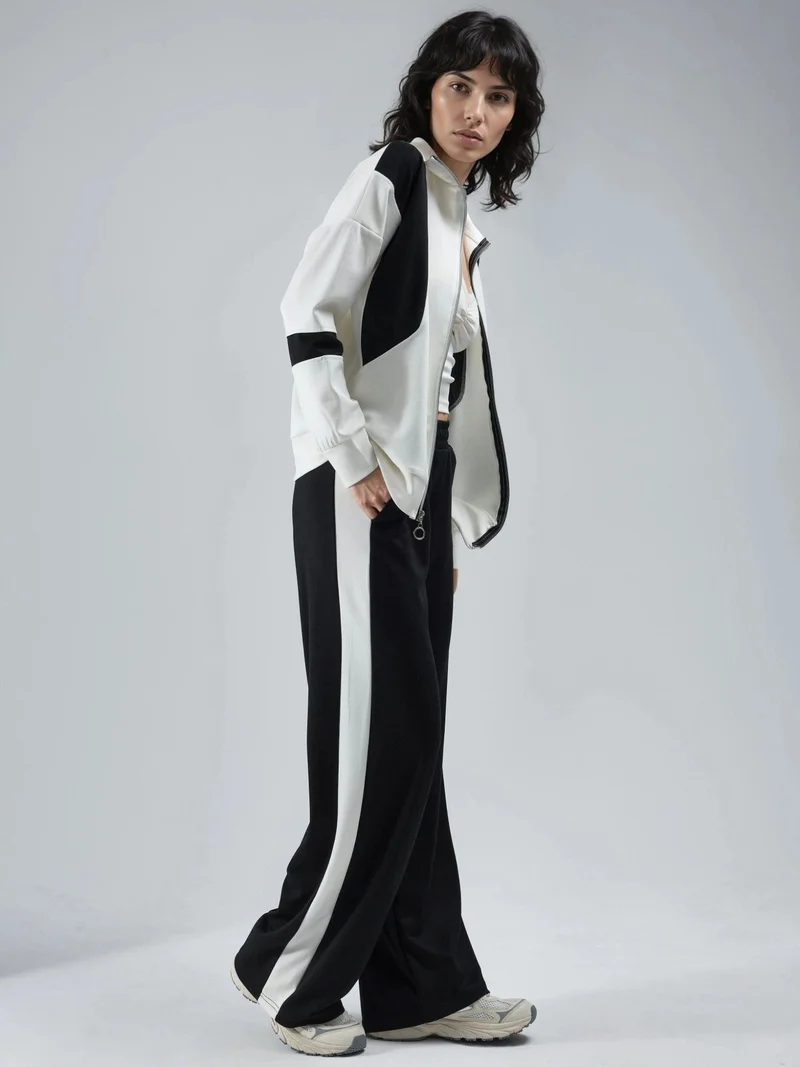 هيكاب طقم قطعتين من مجموعة بيرسان بنقوش لونية وياقة بسحاب وأرجل واسعة